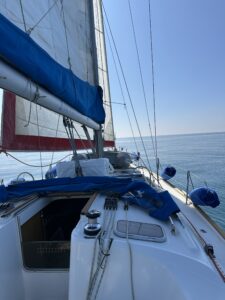 Sailing boat under sail in the La Maddalena archipelago, deep blue sea